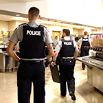 RCMP Cadets walk towards the food serving line at the division Mess.