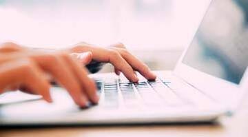 hands typing on keyboard
