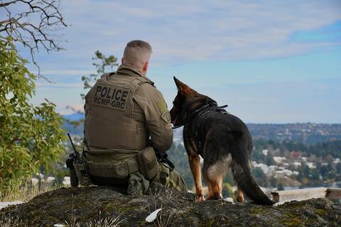 Photo of Halla and Cpl. Lewis from behind