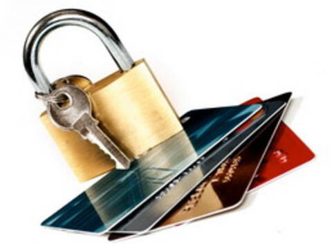Photo of pad lock and keys on top of credit cards to illustrate the message of keeping your credit cards safe.