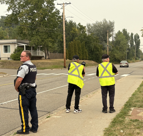 Photo of our Patrol Volunteers conducting road site traffic monitoring in a school zone with RCMP